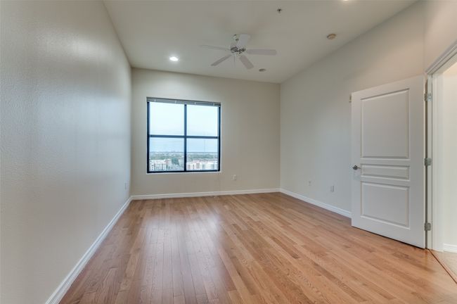 Here’s another look at the primary bedroom, where stunning views serve as a daily backdrop—framed perfectly by oversized windows that fill the space with natural light and showcase the beauty beyond. | Image 27