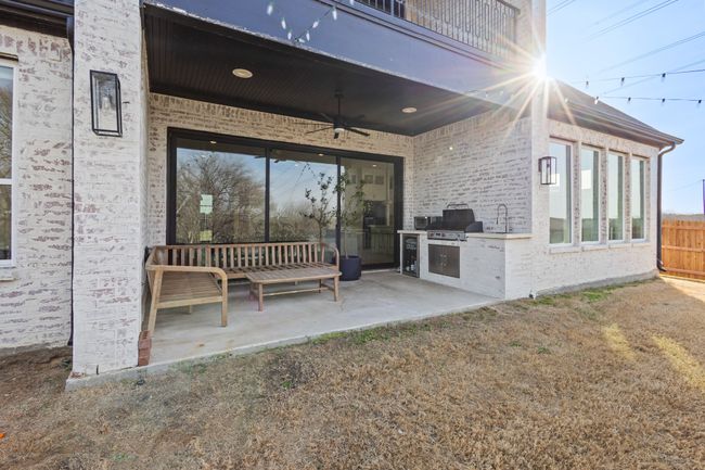 Patio / terrace with exterior kitchen, a ceiling fan, and a patio | Image 30