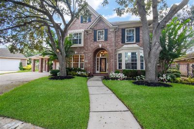 This palatial single family, 2-story brick jewel is located at 1207 Seabury Court, Katy, TX, in a lush, private cul-de-sac, in the Falcon Point community, and sporting a towering new roof (2024). | Image 1