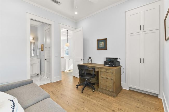 Additional view of guest bedroom with built-in cabinetry and direct bath access. | Image 21