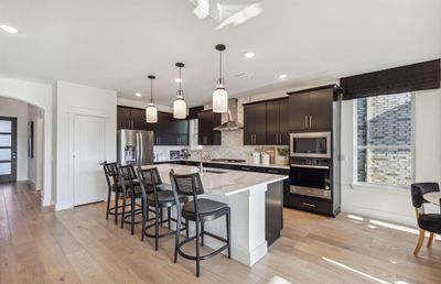 Bright kitchen *Photos of furnished model. Not actual home. Representative of floor plan. Some options and features may vary | Image 3