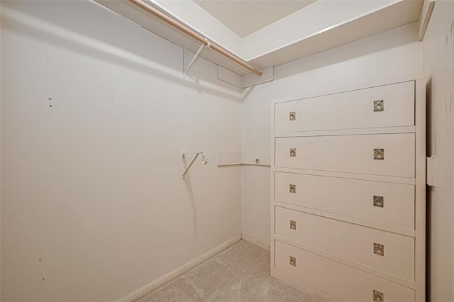 Primary closets each have built-in dressers. | Image 21