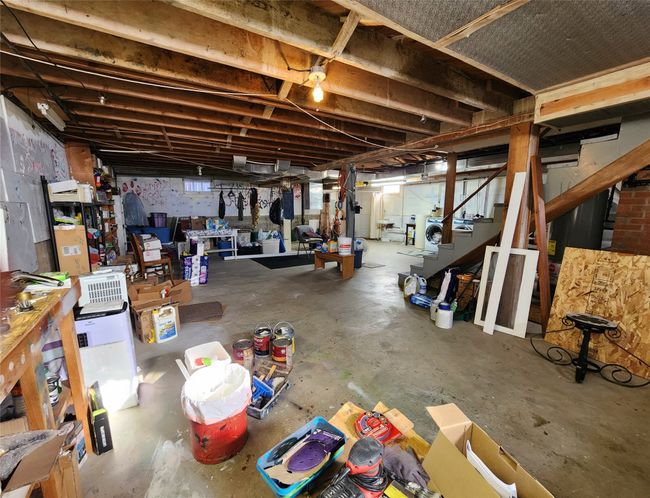 Unfinished basement featuring stairway | Image 44