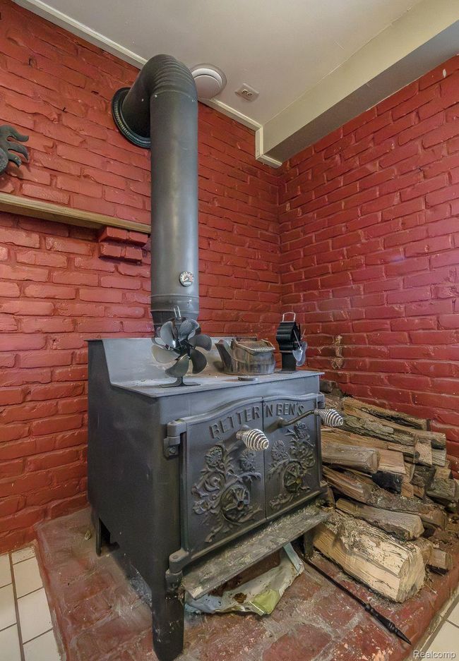 Woodstove in lower level heats the home efficienty | Image 39