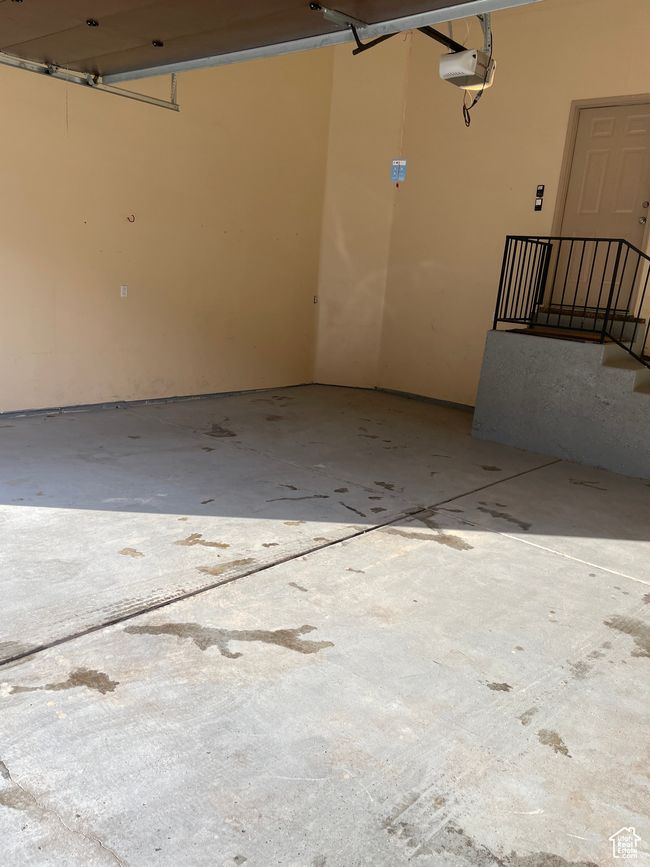 Garage featuring a garage door opener | Image 6