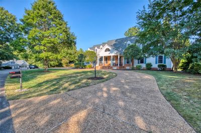 View of front of house with a front yard and covered porch | Image 2