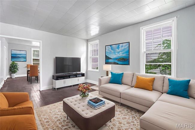 Living area featuring hardwood / wood-style floors and baseboards | Image 11