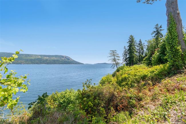 Water view with a mountain backdrop | Image 67