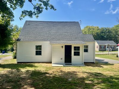 This is the back of the house. The door goes into the utility room. | Image 3