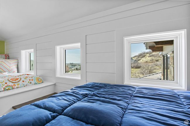 Bedroom featuring multiple windows | Image 116