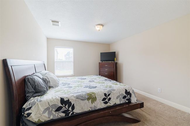Bedroom (not primary) located downstairs. | Image 14