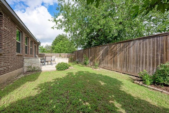Fenced backyard featuring a patio | Image 18