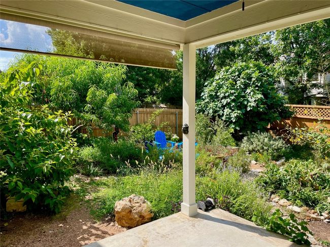 Covered porch with ceiling fan and pull down shade | Image 9