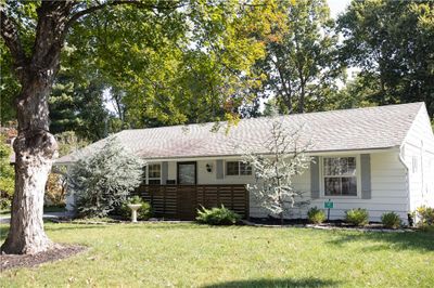 Ranch-style house with a front lawn | Image 1