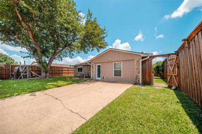 Back of property featuring a fenced backyard and a patio area | Image 29