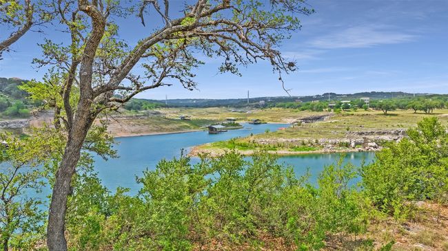 Framed by mature live oaks and native landscape, the site offers a feeling of peace. | Image 7