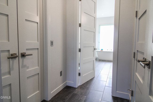 Hallway to Primary Bath - Primary Walk-In Closet & Laundry | Image 47