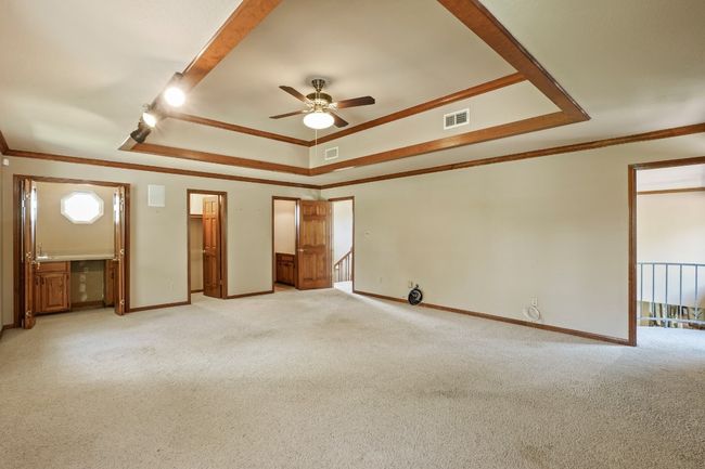 Game room looking at wet bar, walk-in closet, and half bath | Image 17