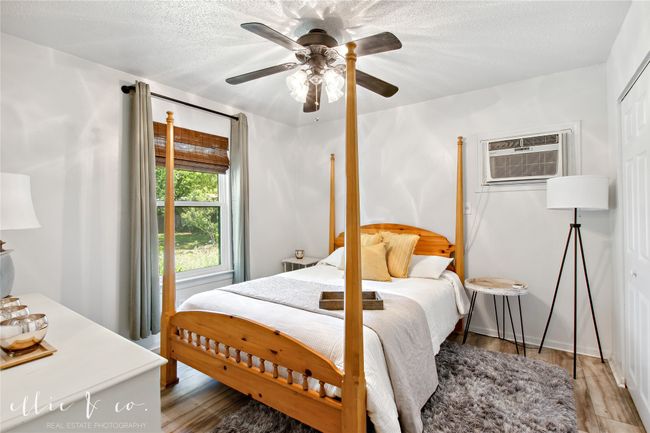 Bedroom in guest house with large closet and nice views out th epdated windows. | Image 28