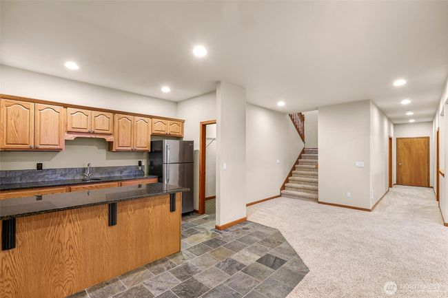 Walk-in pantry off kitchen and another storage room down the hallway | Image 23
