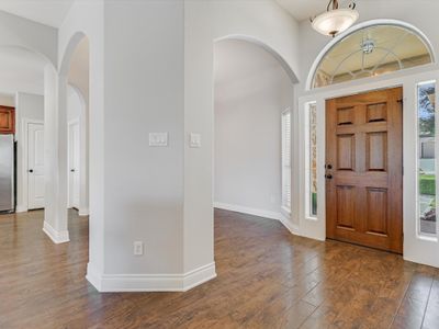 Beautiful floors and welcoming entry with dining area on your right. | Image 2