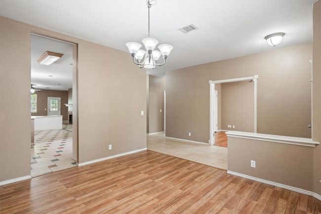 Dining area with chandelier off the entryway | Image 5
