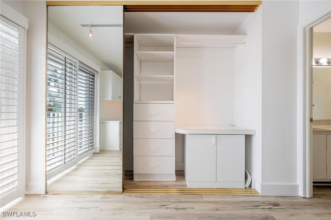 Mirrored closet with built in cabinets and shelving | Image 30