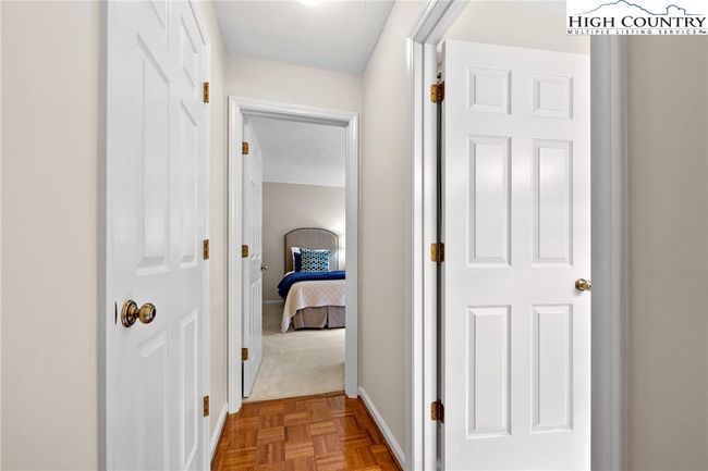 Hallway leading to bath on the right and guest bedroom directly ahead | Image 25