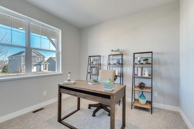 Three bedrooms total in this home, use one as an office! Photo is of a previously built model home, finishes and selections will vary. | Image 14