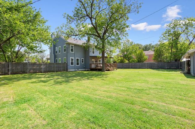 View of yard with a fenced backyard and a wooden deck | Image 31