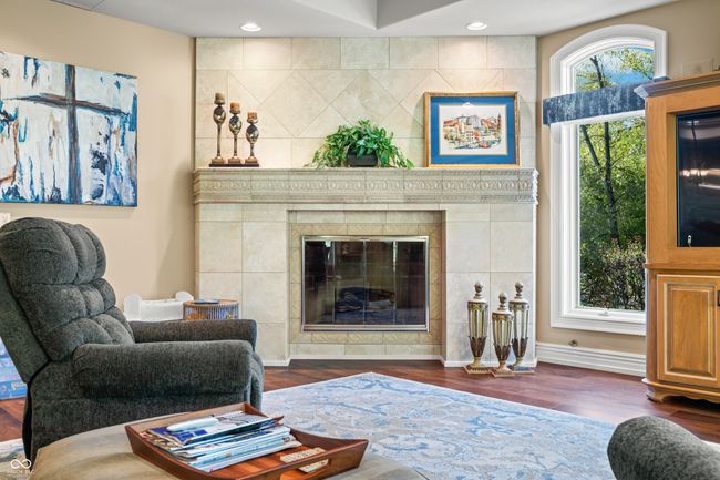 living area with recessed lighting, baseboards, a tiled fireplace, and dark wood-type flooring | Image 18