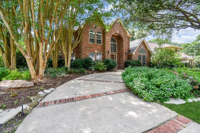 Elegant circular driveway enhances curb appeal and provides easy access. | Image 5