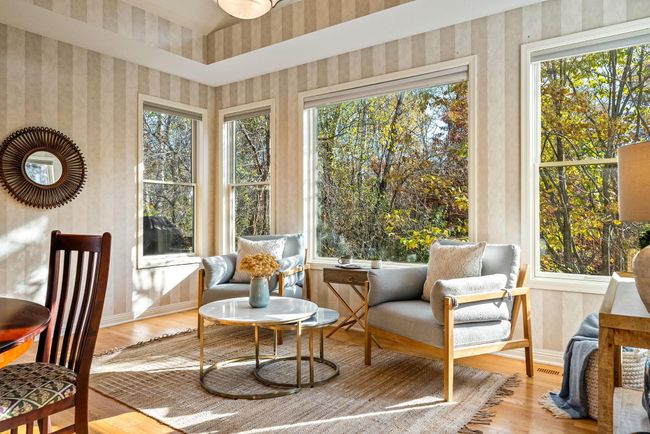 Sunroom off kitchen and informal dining room with a picturesque view. | Image 15