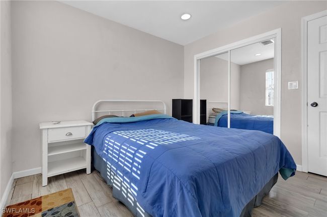 Bedroom with recessed lighting, floors, visible vents, a closet, and baseboards | Image 16