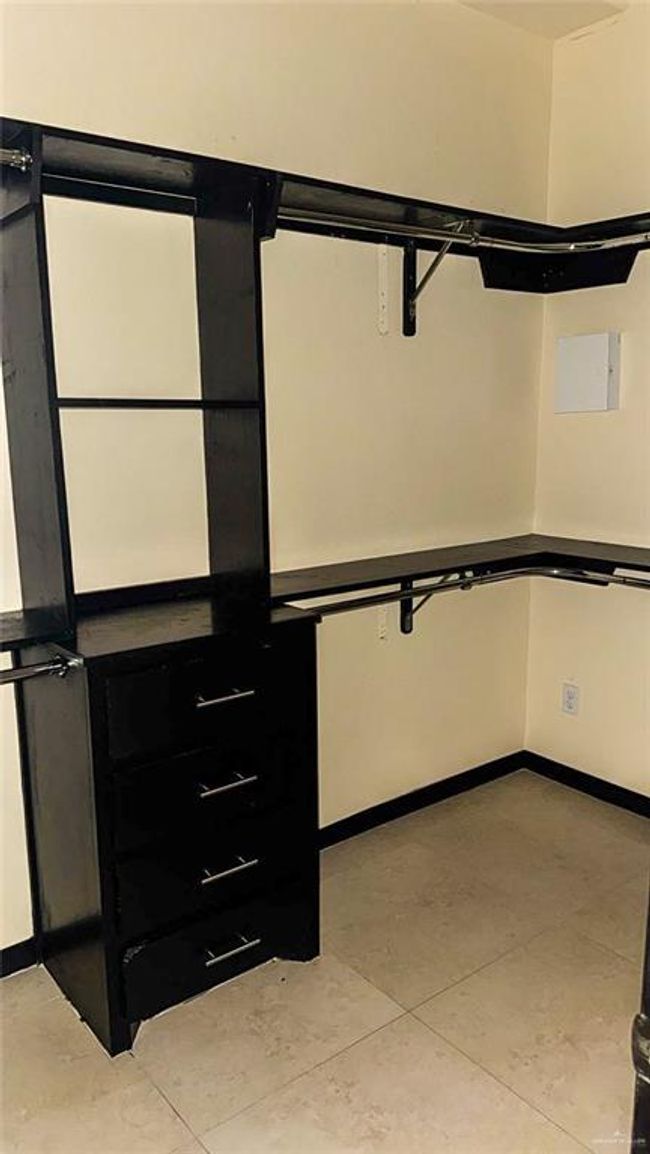 Spacious walk in closet in the primary bedroom. | Image 9