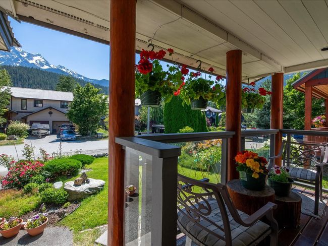 Wooden terrace featuring a mountain view and covered porch | Image 16