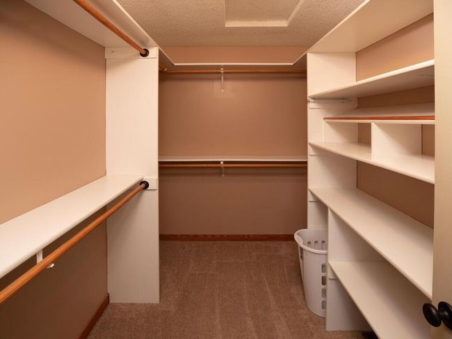 Amazing walk-in closet in primary bedroom | Image 33