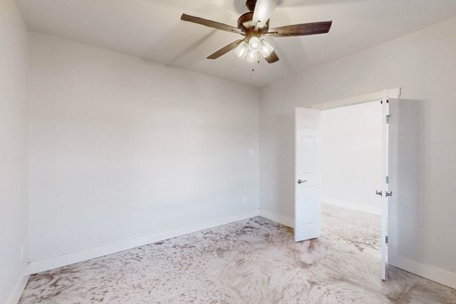 Spare room with light carpet, baseboards, and ceiling fan | Image 37