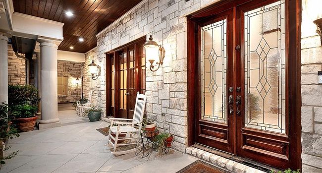 Extensive covered front porch with stained wood ceiling | Image 4
