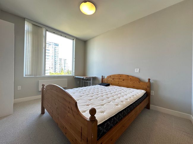 Carpeted bedroom featuring baseboards and radiator heating unit | Image 14
