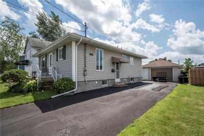 Nicely paved driveway to detached garage. | Image 3