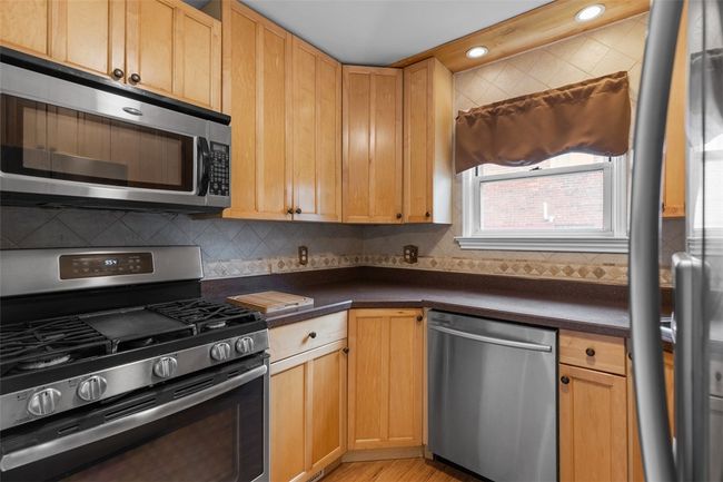 Kitchen with all appliances included. | Image 18