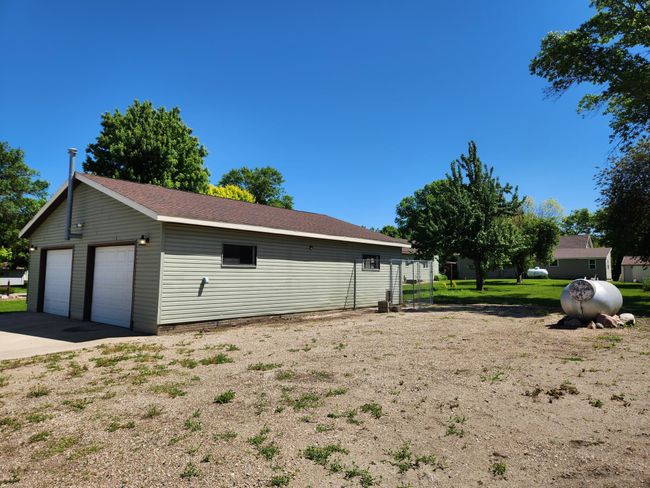 The gravel lot adjacent to south side of garage is perfect for RV, party or those extra vehicles. | Image 22