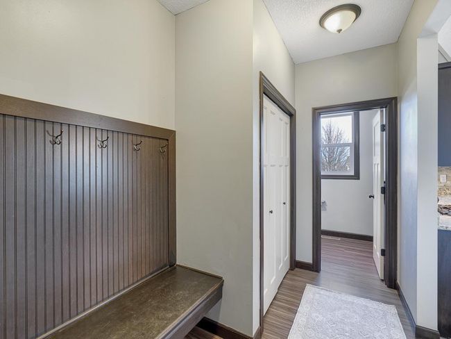 Built in bench with hooks, closet and powder room off of the garage. | Image 16
