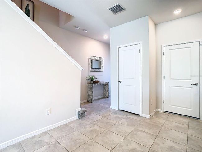 Pantry and door leading to garage | Image 8