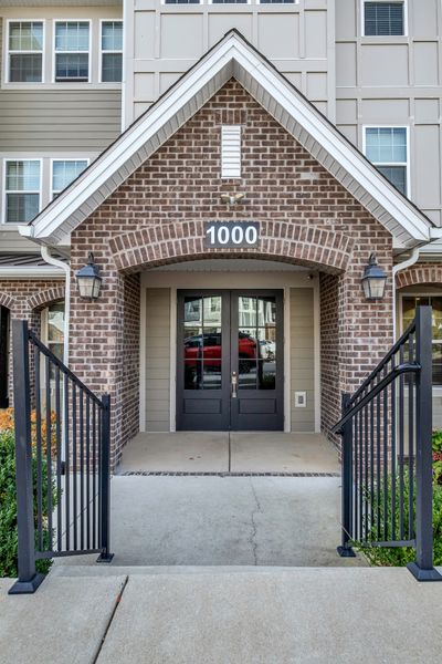 Foyer to building. Key fob secure entry to building once inside the foyer. Unit 1104 is located on the first floor and access to the one car garage is also on the first floor. | Image 1