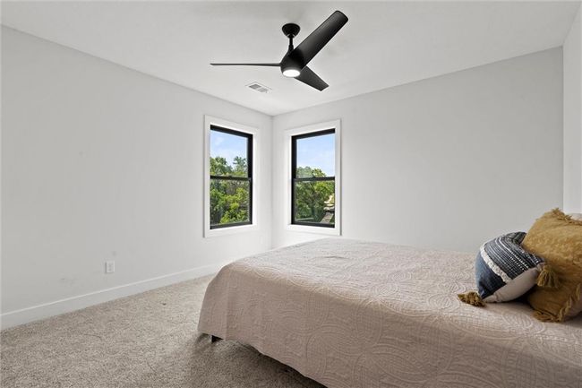 Bedroom featuring carpet flooring and ceiling fan | Image 33