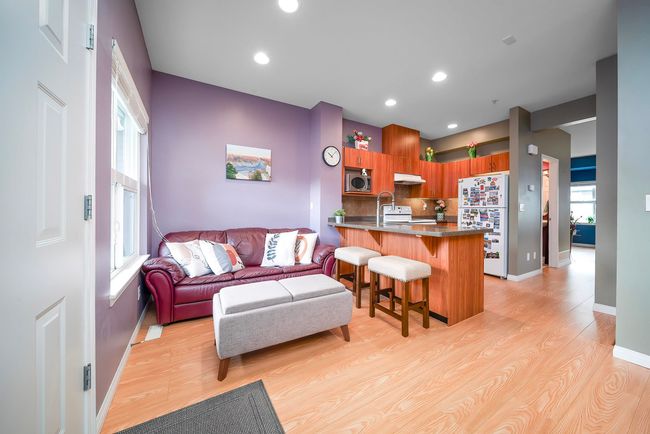 Living room featuring baseboards, light wood finished floors, and recessed lighting | Image 9