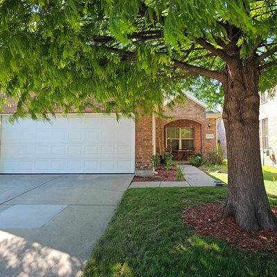 View of front of property featuring a front lawn and a garage | Image 2