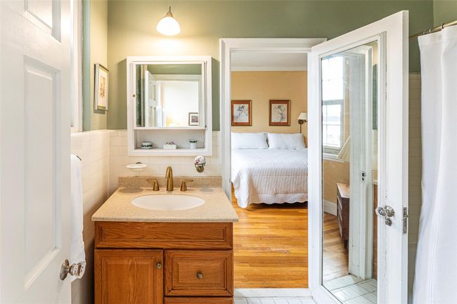 Full bath with tub between two main bedrooms. | Image 9